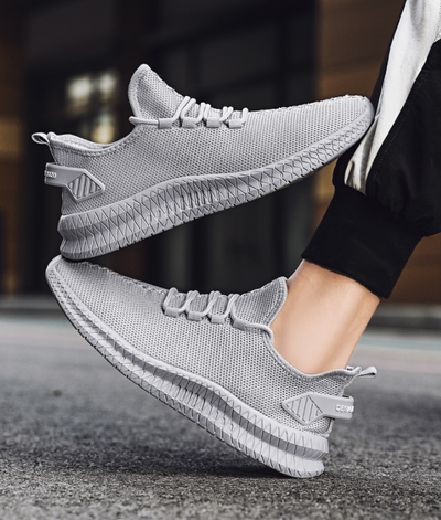 Running Shoes Sneakers Casual Men's Outdoor Athletic Jogging Sports displayed in a stylish grey design.