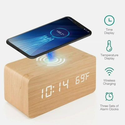 A modern digital alarm clock with a black wooden finish,