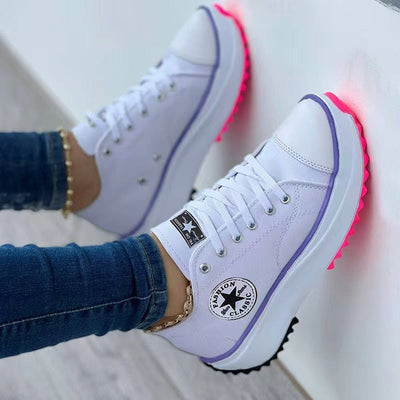 Flat Lace-Up Sneakers Pattern Canvas Casual Sport Shoes worn with denim jeans, showcasing stylish design and vibrant sole.