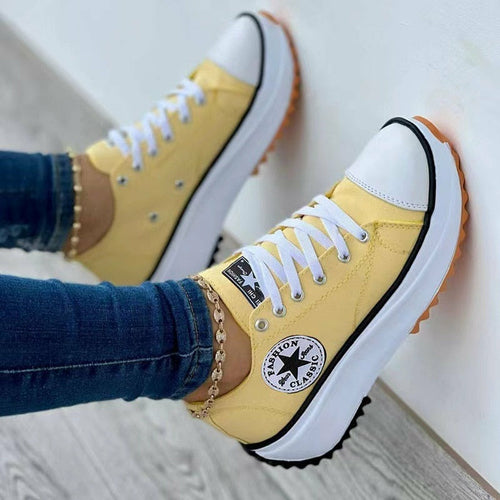 Flat Lace-Up Sneakers Pattern Canvas Casual Sport Shoes in yellow with white laces and rubber sole.