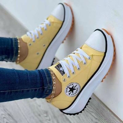 Flat Lace-Up Sneakers Pattern Canvas Casual Sport Shoes in yellow with white laces and rubber sole.