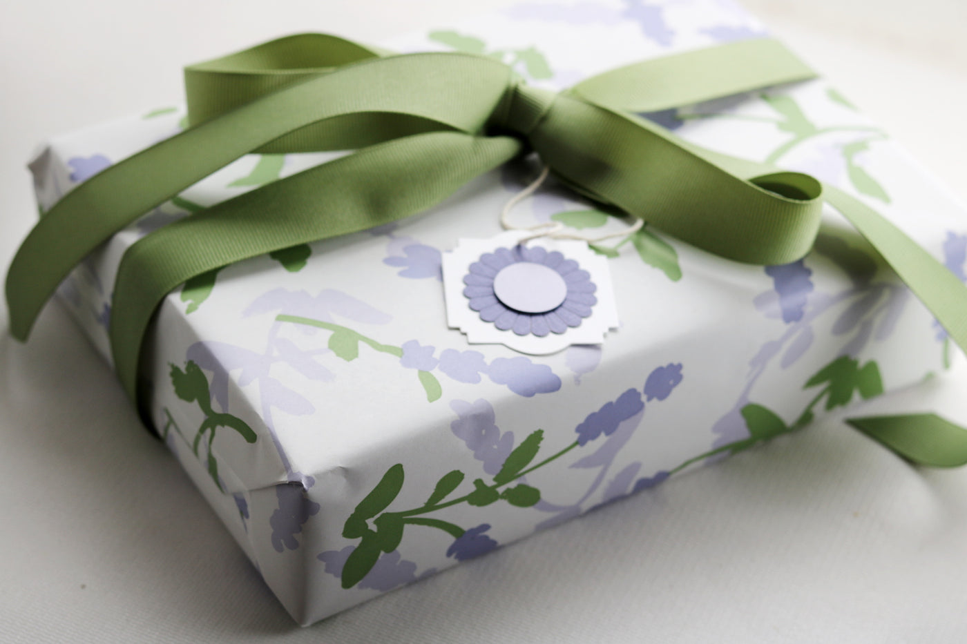 Soap Sampler Gift Set wrapped beautifully in floral paper with a green ribbon, perfect for gifting on Mother's Day.