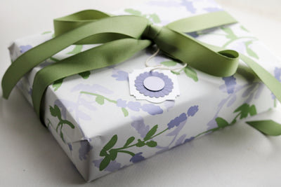 Soap Sampler Gift Set wrapped beautifully in floral paper with a green ribbon, perfect for gifting on Mother's Day.