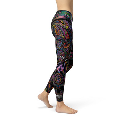 Womens Sugar Skull Leggings showcasing vibrant colors and intricate skull designs on a stylish leg.