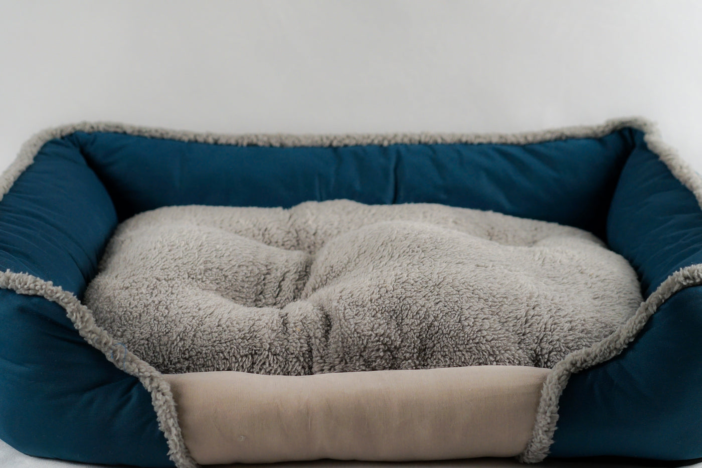 Soft Touch All Seasons 26'' Bed with soft fleece interior and cozy fabric exterior, perfect for pets.
