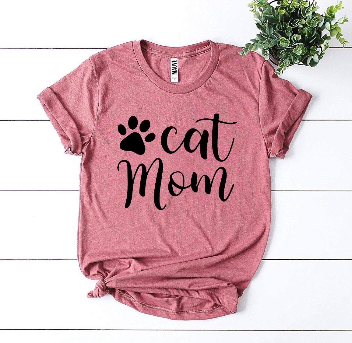 Cat Mom T-shirt in soft red fabric featuring a cute paw print design, showcasing a comfortable retail fit.