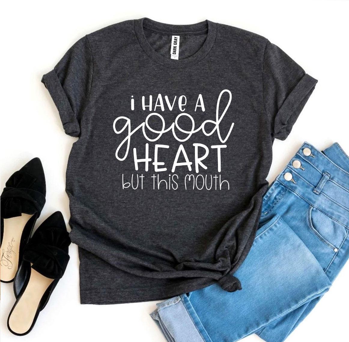 I Have a Good Heart But This Mouth T-shirt on display with stylish denim shorts and high heels.