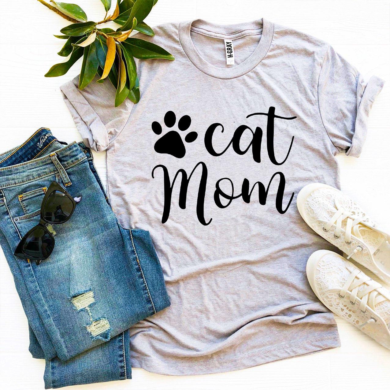 Cat Mom T-shirt displayed with jeans and shoes, featuring a stylish design and soft fabric.