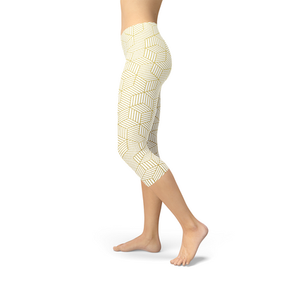 Womens White Capri Leggings w/ Geometric Cubes showcased on a model with a side view.