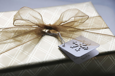 Soap Sampler Gift Set beautifully packaged with a gold ribbon and a tag that reads 'You Santa'.