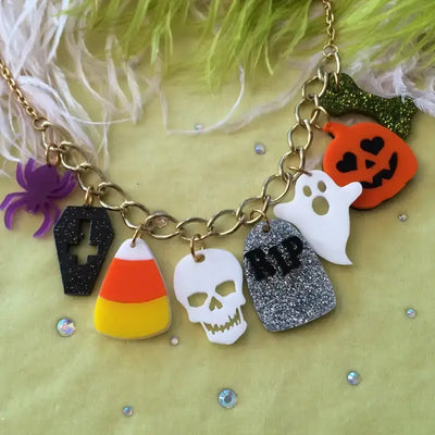 Halloween Accent Charm - Necklace featuring various spooky charms like skulls, pumpkins, and ghosts on a curb chain.